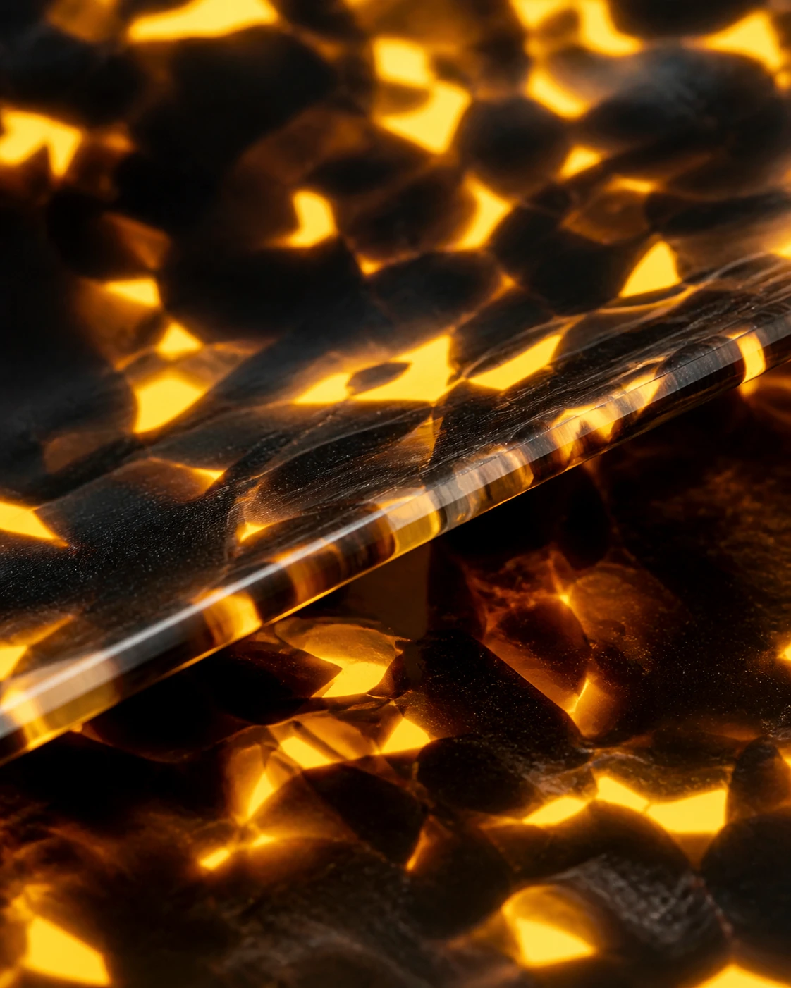 Macro of amber tortoise acetate, light passing through the block.